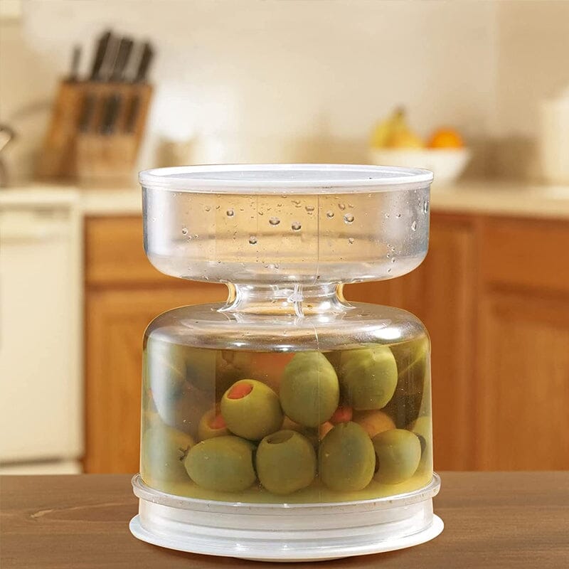 Syltede agurker- og olivenkrukkebeholder med si